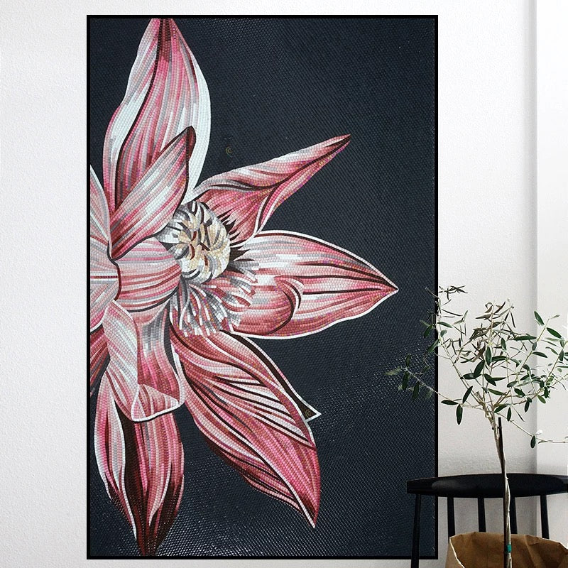 Framed artwork of a pink flower on a dark background