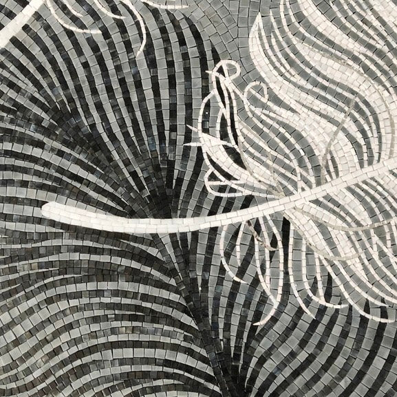 Mosaic artwork of a feather with black and white patterns