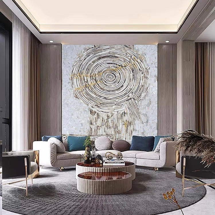 Modern living room with a large abstract mosaic wall art piece.