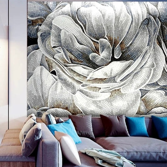 Decorative mosaic wall mural of a floral design in a living room with a sofa and pillows.